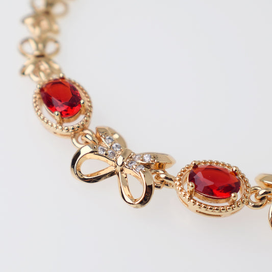 Pulsera Moñito con Cristales  Blancos y Rojos - Baño 18K