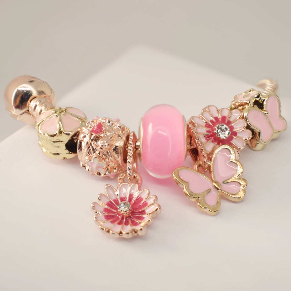 Pulsera Rosa con Charms flor de loto y mariposa  - Acero